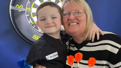 Jess Lord / BBC Lucas hugging his grandmother