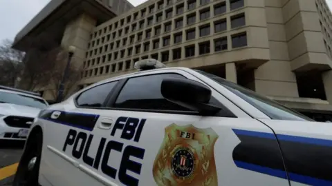 Reuters FBI police vehicles sit parked outside of the J Edgar Hoover Federal Bureau of Investigation Building in Washington, 1 February 2018