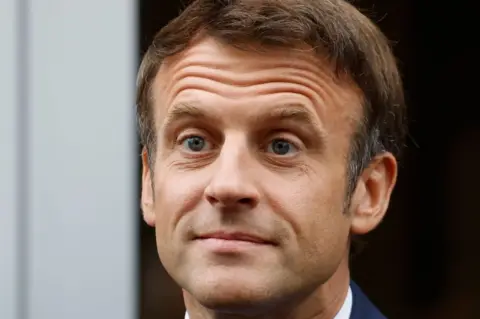 Getty Images Emmanuel Macron arriving to vote in the second stage of French parliamentary elections at a polling station in Le Touquet, northern France