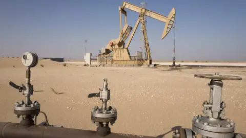 Getty Images Drilling for oil along in the South Kuwait desert, Saudi Arabia, near the border with Iraq, 12 September 12 2016