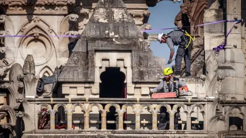 EPA Workers consolidate the north face of Notre-Dame threatening to collapse in the aftermath of the fire