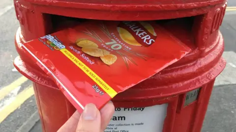 BBC Crisp packet being posted