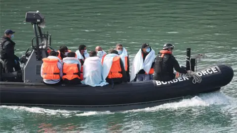 EPA Migrants on a Boarder Force boat