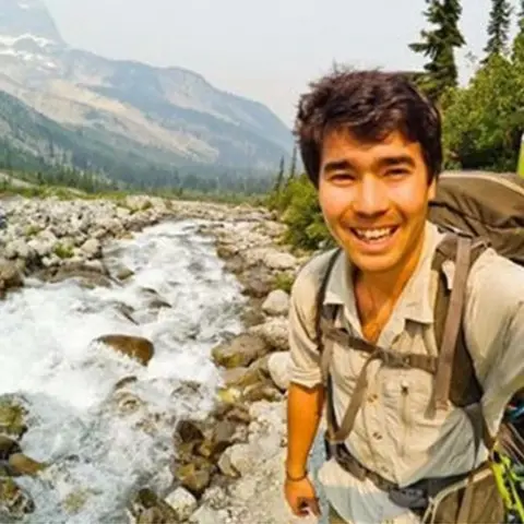 Instagram/ John Chau Chau near a waterfall