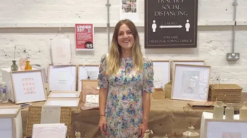 Amelia Terry Amelia at a stall selling her goods