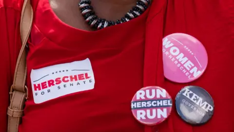 Getty Images Woman wearing candidate pins