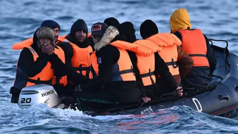 Getty Images Migrants in a small boat in the English Channel