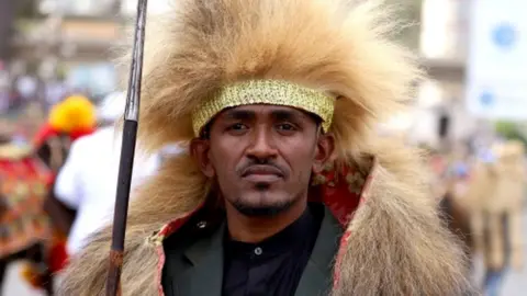 Reuters Ethiopian musician Hachalu Hundessa poses while dressed in a traditional costume during the 123rd anniversary celebration of the battle of Adwa, where Ethiopian forces defeated invading Italian forces