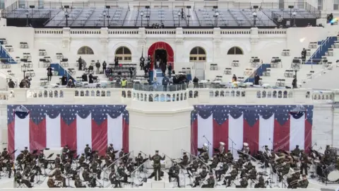 Pool/Getty Images Preparations are made prior to a dress rehearsal ahead of the 59th Inaugural Ceremonies on the West Front at the US Capitol