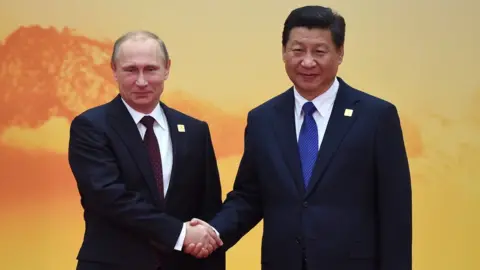 GREG BAKER/AFP/Getty Images Vladimir Putin and Xi Jinping