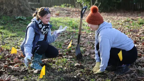 University of Worcester Students planting flowers