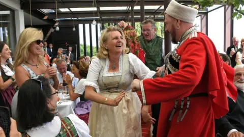 AFP Ms Kneissl dancing with Cossack