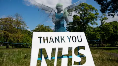 PA Media Sculptor Luke Perry"s winged medical worker, which has been installed at a park near Birmingham paying tribute to the NHS and care workers during the coronavirus pandemic