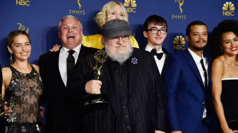 Getty Images George RR Martin (centre) with members of the Game of Thrones cast