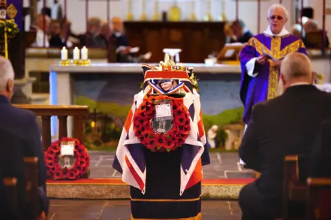 PA Media Coffin in church