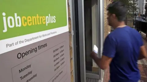 PA Media Man going into jobcentre