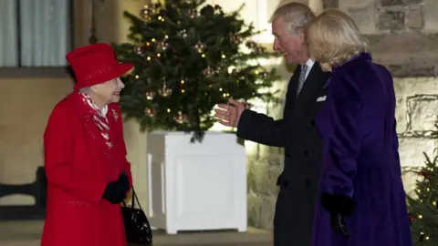 Getty Images The Queen speaks to Prince Charles and Camilla