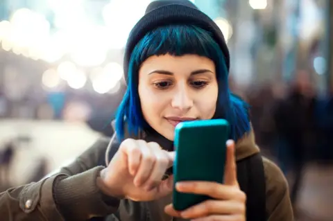 Getty Images girl on smartphone