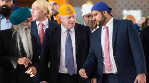Pete Maclaine / i-Images Samir Jassal (right), pictured with Boris Johnson in 2019, has campaigned alongside the prime minister