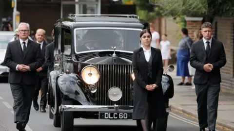 Getty Images The funeral procession in Barnes, south-west London