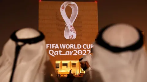 Getty Images The Qatar World Cup logo projected onto a building