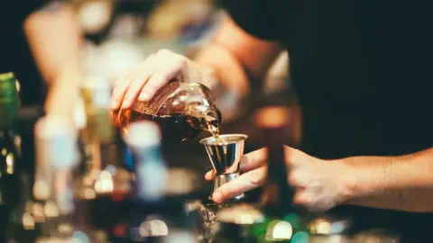 Getty Images Alcohol pouring into glass