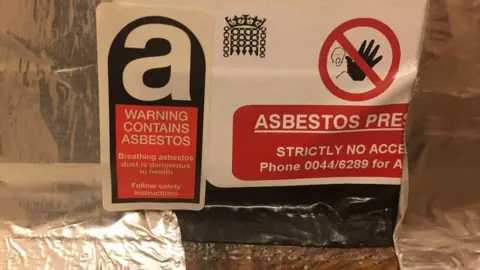 Anonymous Asbestos warnings in Parliament