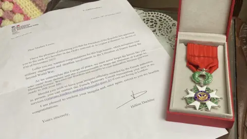Jo Makel/BBC Image of the Legion d'Honneur medal and letter