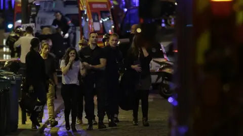 Getty Images People are evacuated following an attack at the Bataclan concert venue in Paris, on November 13, 2015