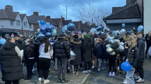 People holding balloons