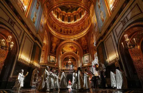 Oleg Varov / AFP Russian Orthodox Patriarch Kirill celebrate the Easter service in the Christ the Savior Cathedral in Moscow.