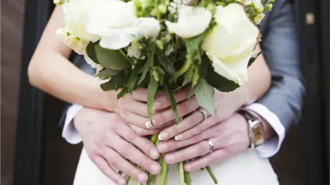 Stock image showing a bride and groom