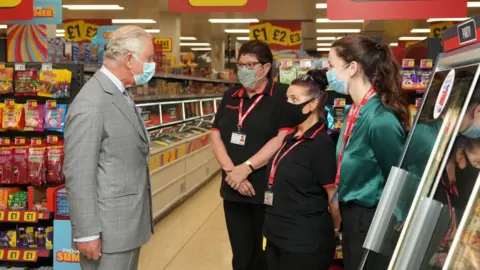 PA Media The Prince of Wales talks to staff during a visit to the headquarters of Iceland Foods Ltd, Flintshire