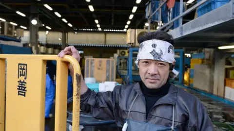 Getty Images A vendor at Tsujiki market stands by a palette