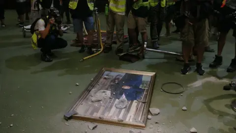 EPA A picture of a council member is on the floor