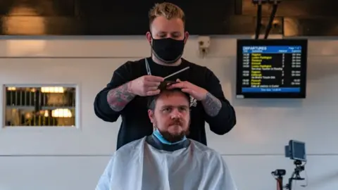 GWR Man getting haircut at station