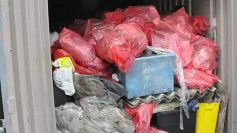 Environment Agency Asbestos in storage container