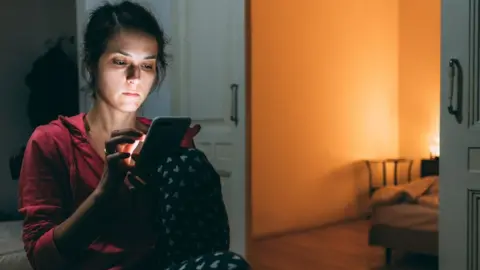 Getty Images Woman on phone