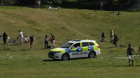 PA Media Police officers patrol Greenwich Park, London