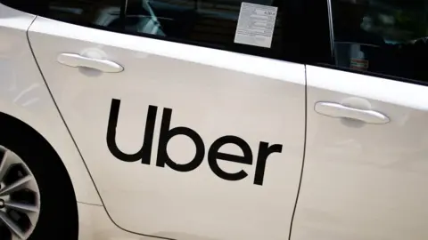 NurPhoto Car with Uber branding on the door