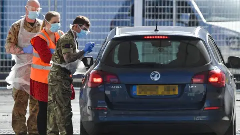 PA Media Picture taken at 1046am of Military personnel help administer Covid19 tests for NHS workers at Edgbaston cricket ground in Birmingham