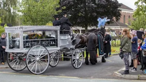 PA Media Denise Johnson's coffin