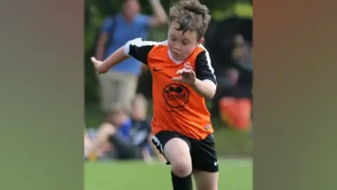 Family Rafe Lawton playing football