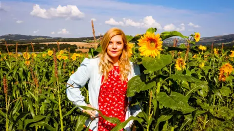 Portia Jones Portia Jones in a field of sunflowers