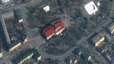 Maxar/Reuters The destroyed theatre in Mariupol before the bombing