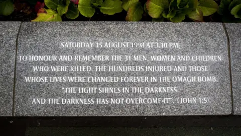 PA An inscription at the Omagh bomb memorial garden