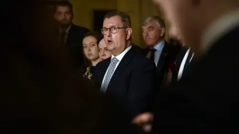 Getty Images Sir Jeffery Donaldson surrounded by people