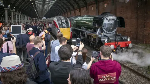 PA Media People photographing Flying Scotsman at Darlington train station