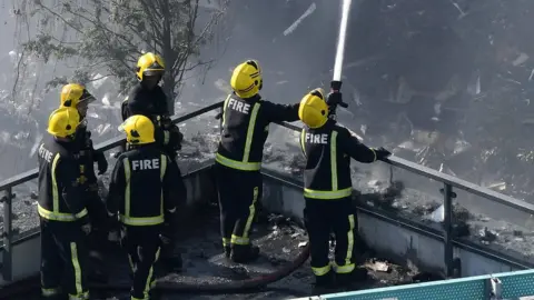 EPA Fire crews at Grenfell Tower on 14 June 2017