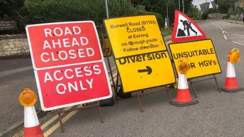 Road closure signs